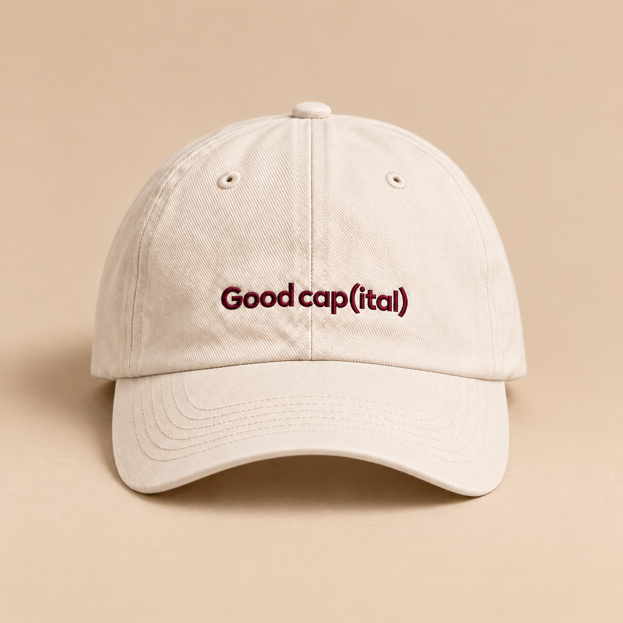 The Good cap(ital) cap, front view showing embroidered lettering