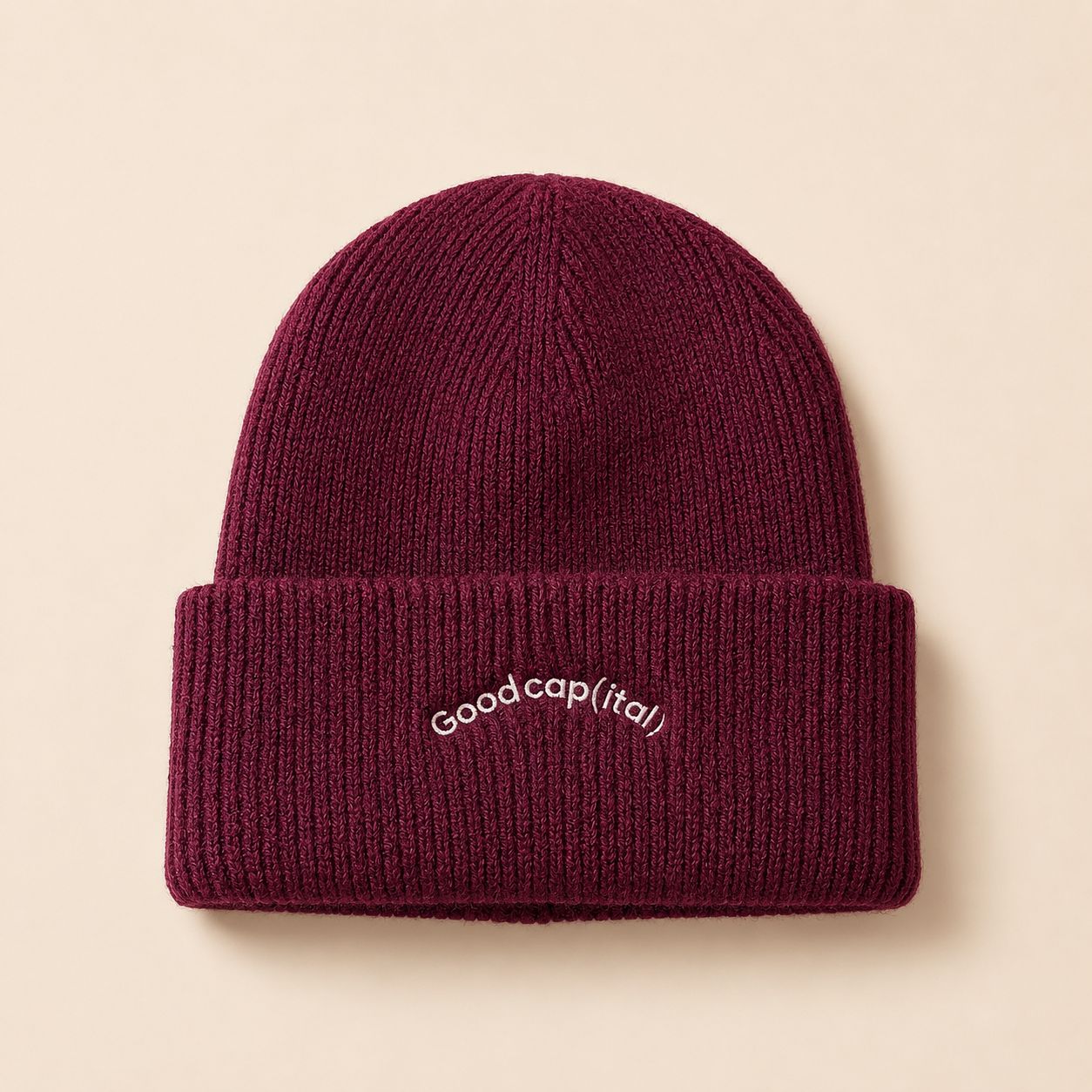 The Good cap(ital) beanie, front view showing embroidered lettering